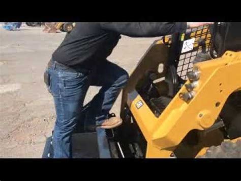 cat skid steer bucket removal